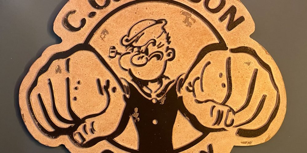 Cartel de Madera en relieve C.C. FILSON POPEYE COMPANY